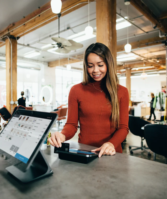 Shop owner using a POS system